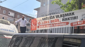 Kemal Aygün’den Sultaniye’de sıra dışı eylem: Elektrik direğine tırmandı, kesilen pankartı tekrar yerine astı!