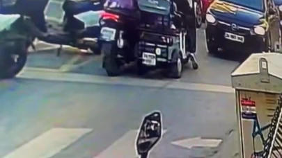 Aracıyla motosikletli kadına çarpıp darbetti!