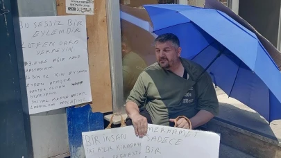 Evden çıkarılan kalp hastası kiracıdan 'Benim kalbim hasta, senin vicdanın' yazılı pankartla eylem